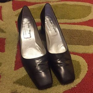 Black leather Robert Clergerie for Barney’s heels